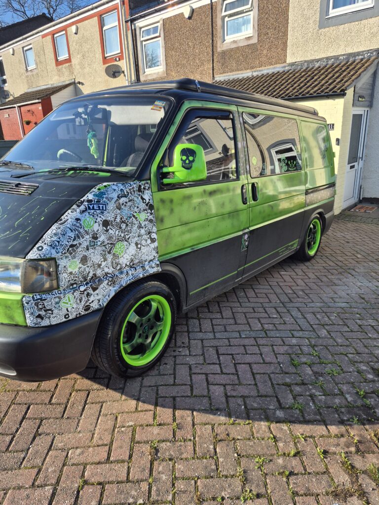 Dan's VW T4 Campervan Story Elain Midlands Dub Club and Real Van Life 2 Side view of VW T4 Elain with green and black paint parked on a residential driveway