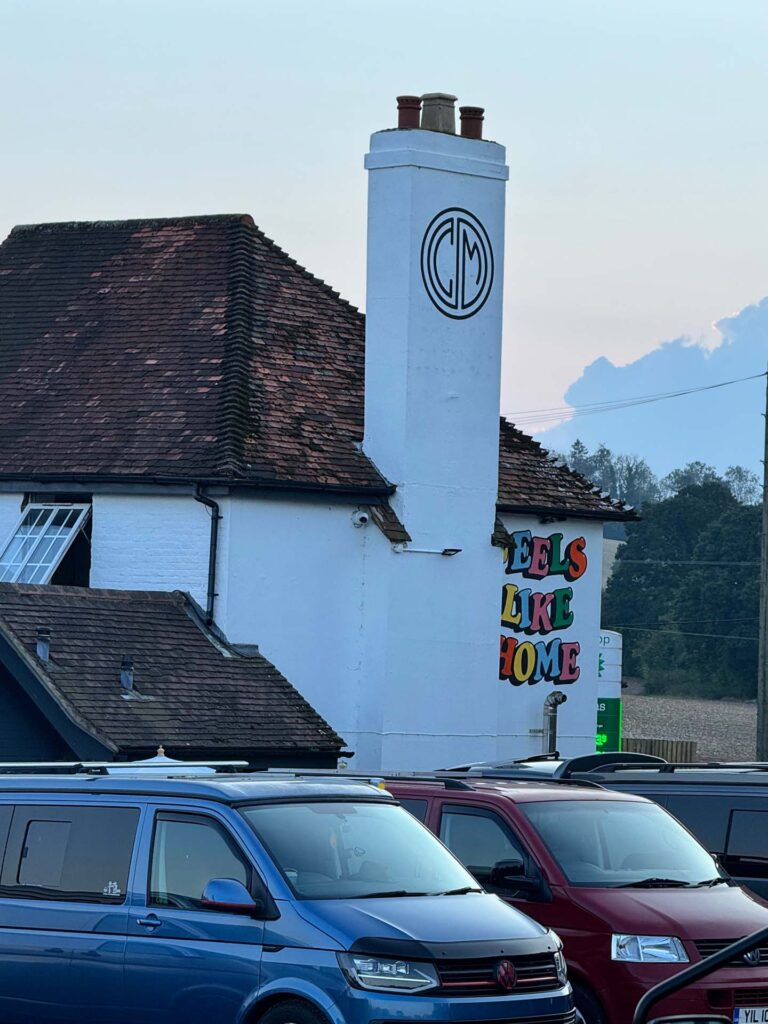 Best VW Shows UK 2026 – Top Volkswagen Festivals & Campervan Events 6 VW Transporters parked outside Caffeine and Machine The Hut