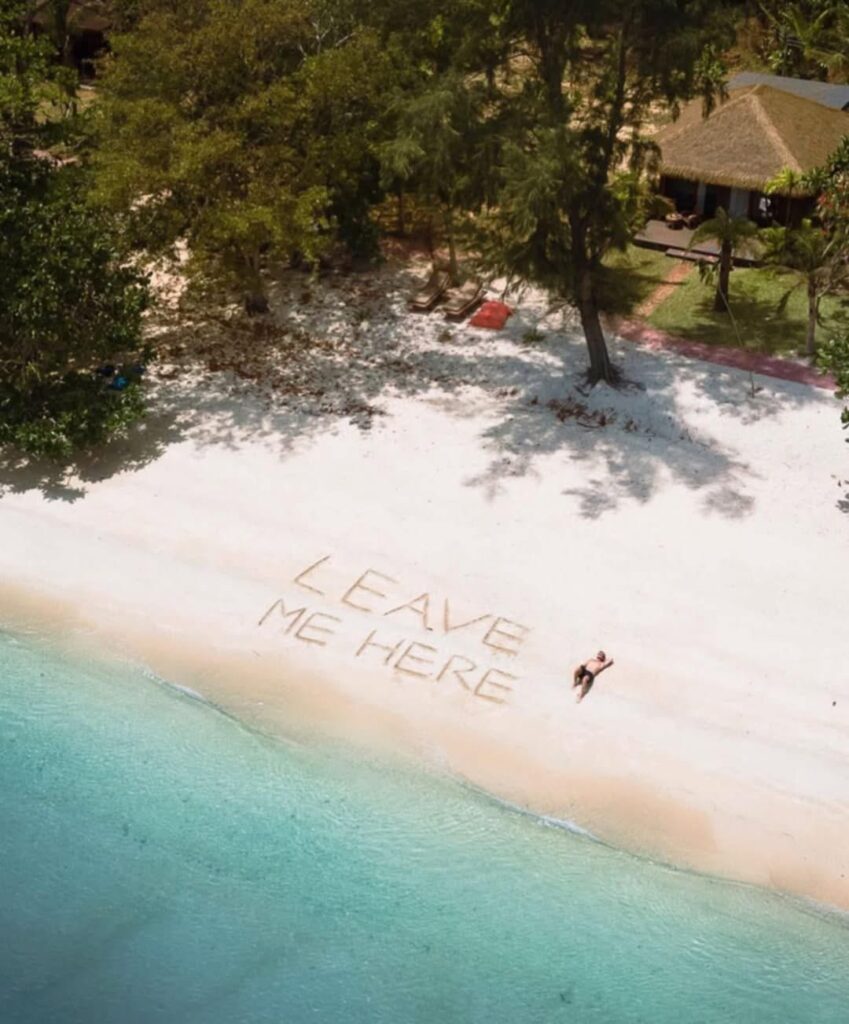 Van Life Europe: Mark, Nikki & Sid’s Journey | Choosing Freedom on the Road 8 Beach scene with leave me here message representing freedom of van life
