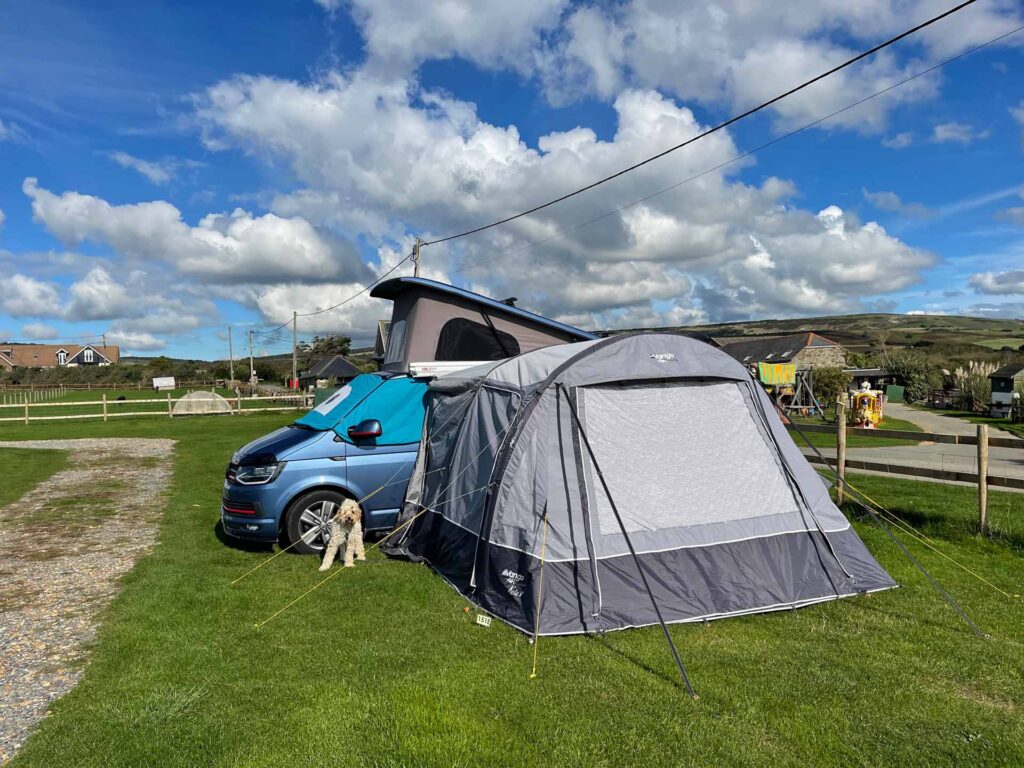 VW T6 Camper Van Lifestyle: Life on the Road with Franky the Campervan 3 VW T6 camper van campsite setup with Vango awning and camper van dog