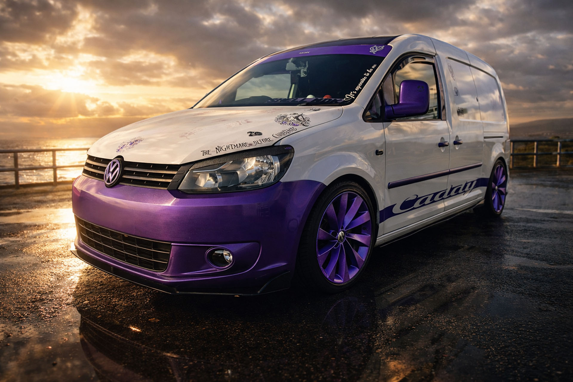 VW Caddy Maxi camper build Cammy parked by the coast at sunset