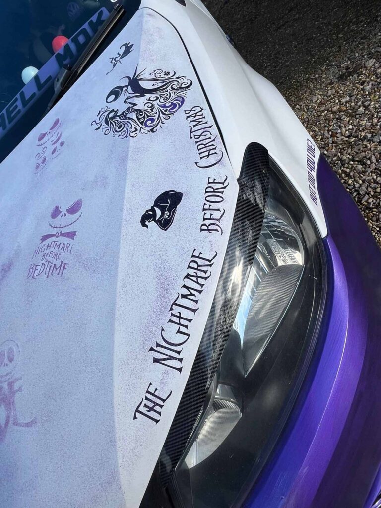 Custom bonnet detail on VW Caddy Maxi camper build with themed graphics