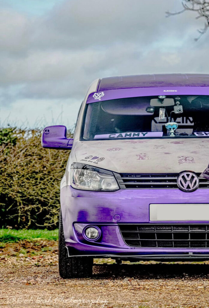 Front view of VW Caddy Maxi camper build with custom purple styling