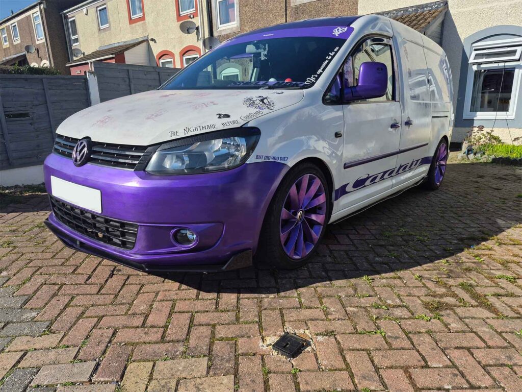 Side view of VW Caddy Maxi camper build Cammy parked on driveway