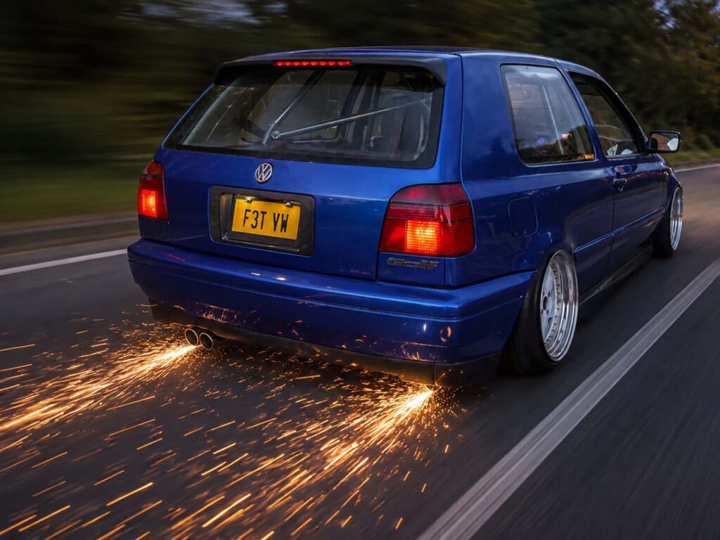 Built, Not Bought: The Story Behind Luke's Modified Mk3 Golf 6 Luke's modified Mk3 Golf driving on the road with its air suspension lowered