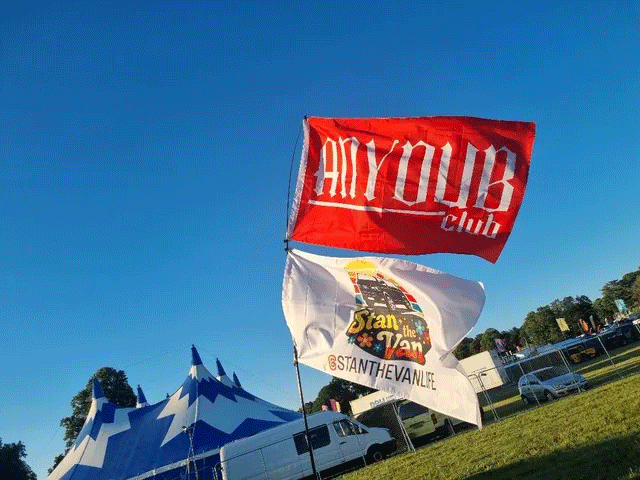 AnyDub Club and Stan the Van Life flags at a Volkswagen event