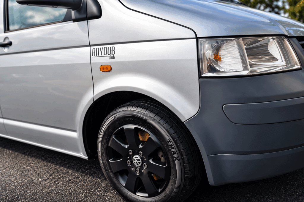 Stan the Volkswagen T5 with AnyDub Club sticker and black wheels