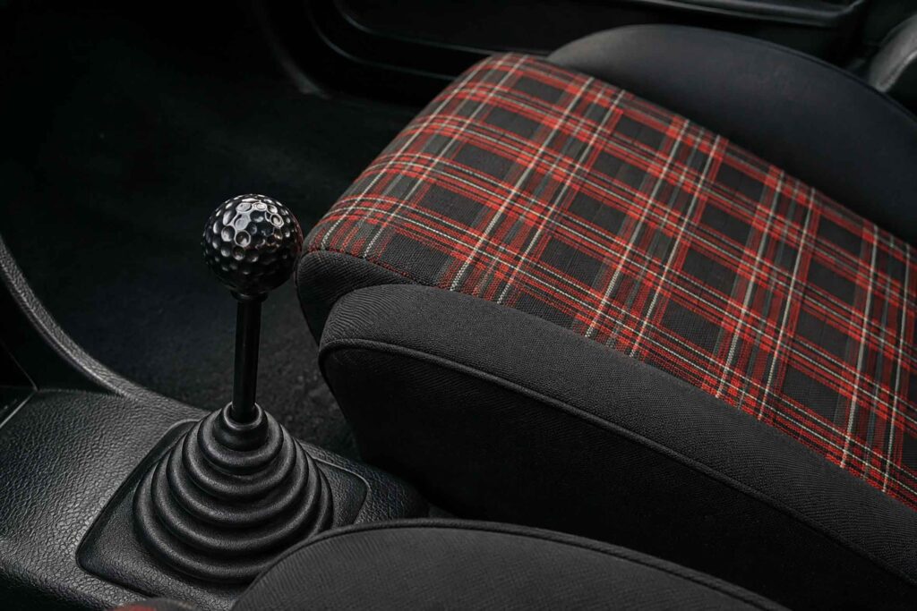 50 Years of the Golf GTI: The Car That Changed VW Culture 1 Mk1 Golf GTI tartan seat and black golf-ball gear knob