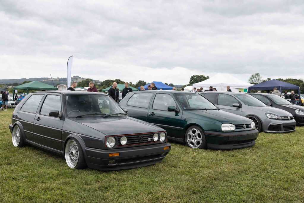 50 Years of the Golf GTI: The Car That Changed VW Culture 2 Modified Volkswagen Golf GTIs displayed at a grassroots UK VW show